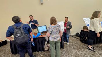 people presenting posters