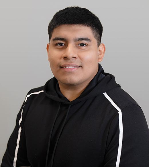 Headshot of Bryan smiling