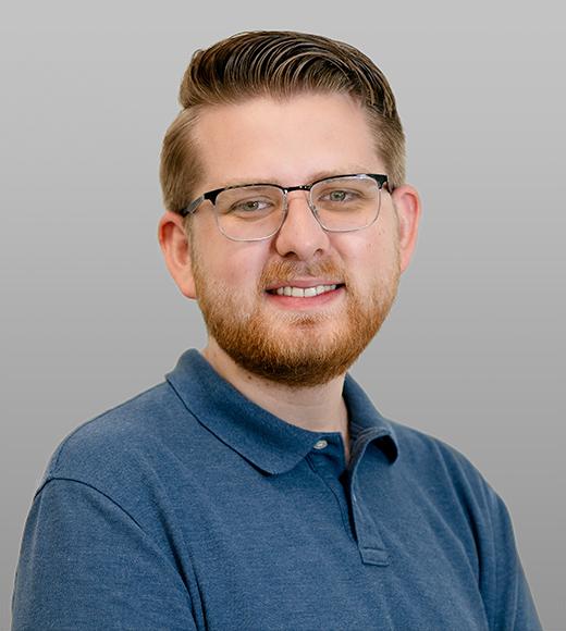 Headshot of Ethan smiling