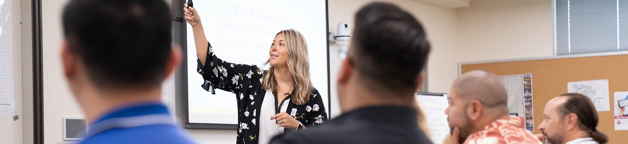 woman smiling and answering questions during a workshop